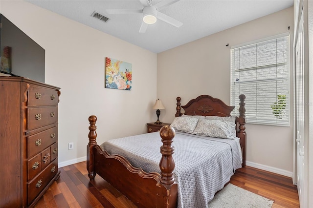 5321 Los Palma Vista Dr, Orlando, FL 32837 - bedroom with baseboards, ceiling fan, dark wood-type flooring, and visible vents