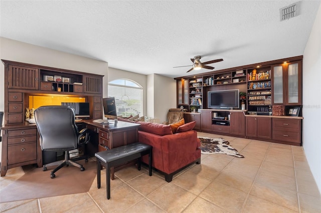 5321 Los Palma Vista Dr, Orlando, FL 32837 - living room featuring light tile patterned floors, a ceiling fan, a textured ceiling, and visible vents