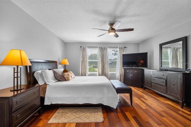 5321 Los Palma Vista Dr, Orlando, FL 32837 - bedroom featuring ceiling fan, a textured ceiling, and wood finished floors