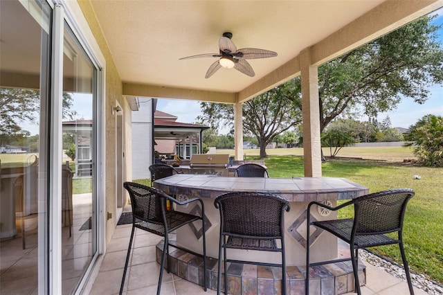 5321 Los Palma Vista Dr, Orlando, FL 32837 - view of patio featuring an outdoor bar, ceiling fan, and grilling area
