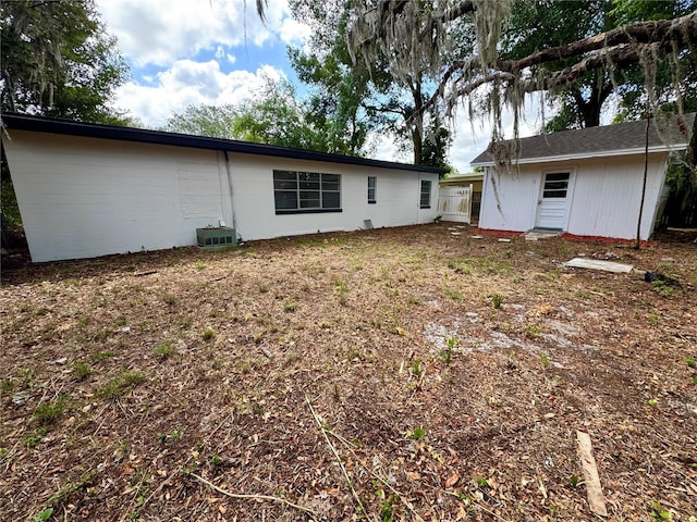 rear view of house with cooling unit