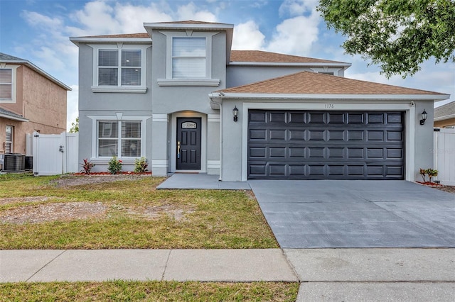 1176 Epson Oaks Way, Orlando, FL 32837 - traditional-style home featuring central AC unit, a garage, fence, concrete driveway, and stucco siding