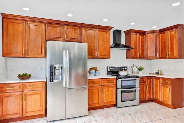 1176 Epson Oaks Way, Orlando, FL 32837 - kitchen featuring wall chimney range hood, light countertops, stainless steel appliances, recessed lighting, and decorative backsplash
