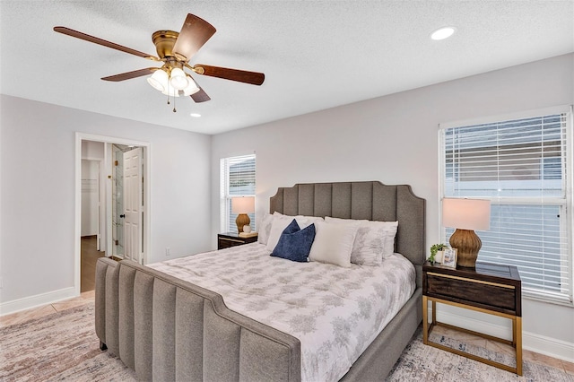 1176 Epson Oaks Way, Orlando, FL 32837 - bedroom featuring baseboards, recessed lighting, a textured ceiling, and ceiling fan