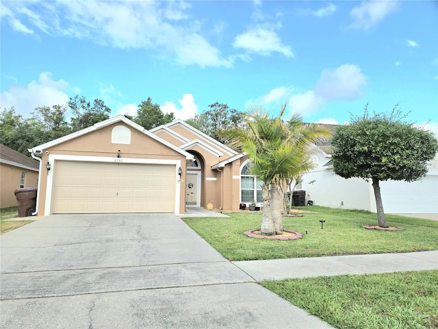2346 Lily Pad Ln, Kissimmee, FL 34743 - ranch-style house with an attached garage, a front lawn, stucco siding, and driveway