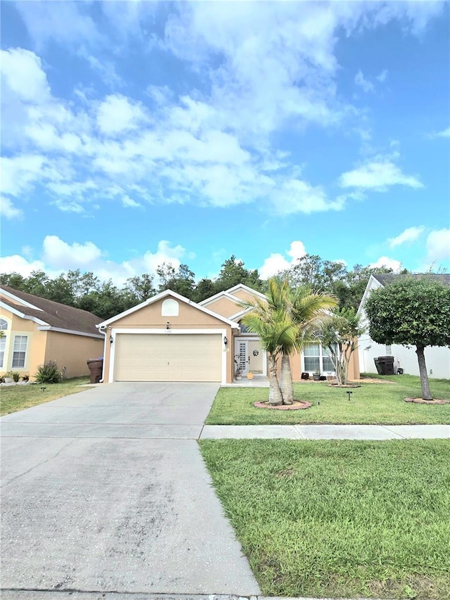2346 Lily Pad Ln, Kissimmee, FL 34743 - single story home with a garage, stucco siding, concrete driveway, and a front yard