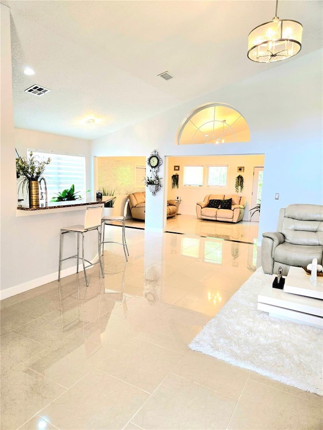 2346 Lily Pad Ln, Kissimmee, FL 34743 - living room featuring baseboards, visible vents, and tile patterned flooring