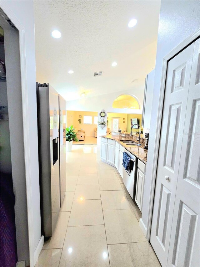 2346 Lily Pad Ln, Kissimmee, FL 34743 - kitchen featuring appliances with stainless steel finishes, a sink, visible vents, recessed lighting, and vaulted ceiling