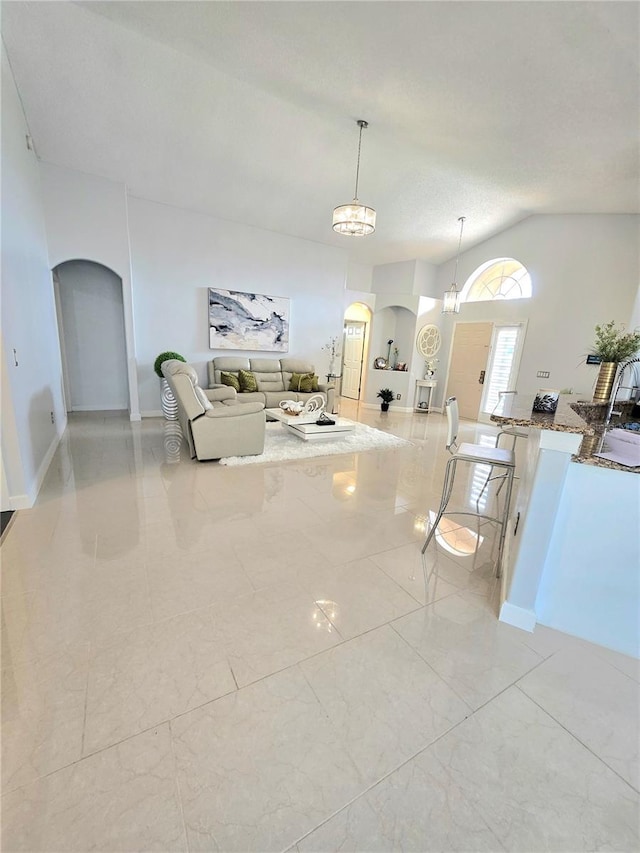 2346 Lily Pad Ln, Kissimmee, FL 34743 - interior space featuring arched walkways and lofted ceiling
