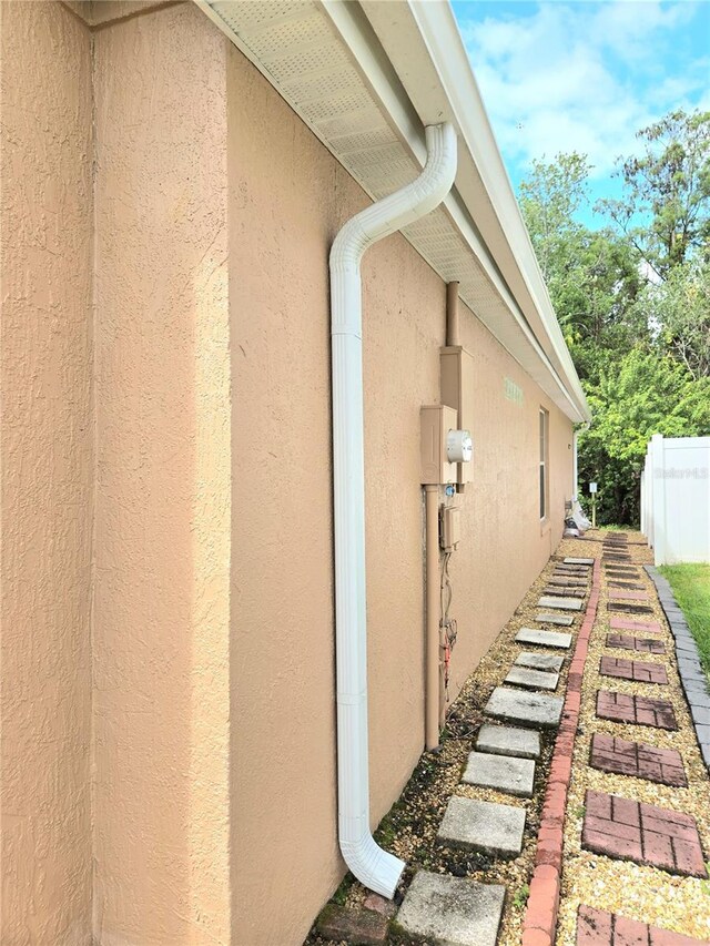2346 Lily Pad Ln, Kissimmee, FL 34743 - view of side of home with fence and stucco siding