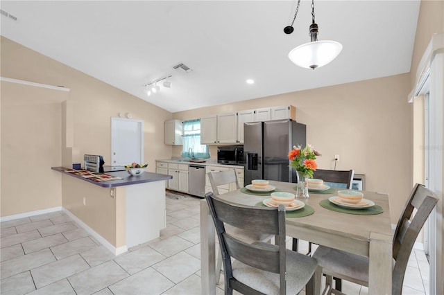 kitchen with visible vents, hanging light fixtures, rail lighting, a peninsula, and stainless steel appliances