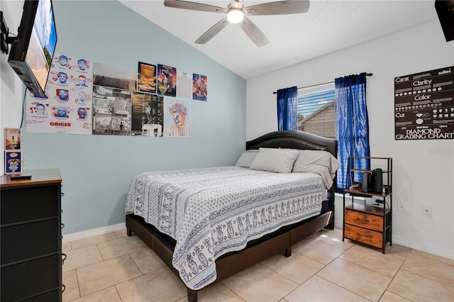 tiled bedroom featuring baseboards, a ceiling fan, and vaulted ceiling