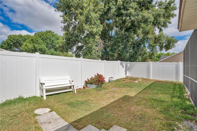 view of yard with a fenced backyard