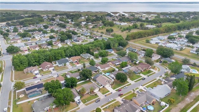aerial view with a residential view and a water view