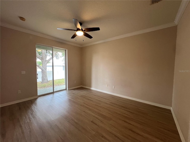 unfurnished room featuring a ceiling fan, baseboards, ornamental molding, and wood finished floors