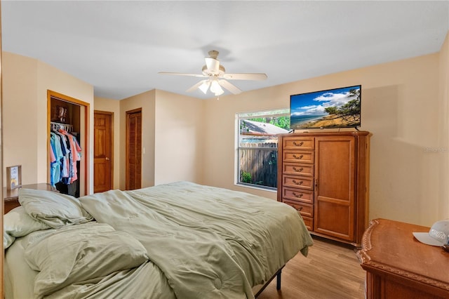 bedroom featuring light wood-style floors and ceiling fan