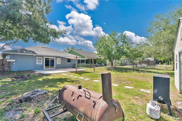 view of yard with a patio and fence
