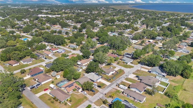 birds eye view of property with a residential view and a water view