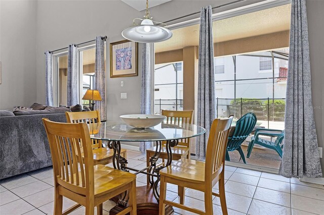 209 Rosso Dr, Davenport, FL 33837 - dining area featuring healthy amount of natural light and light tile patterned flooring