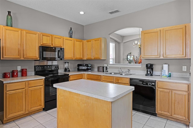 209 Rosso Dr, Davenport, FL 33837 - kitchen featuring black appliances, a sink, light tile patterned flooring, arched walkways, and light brown cabinetry