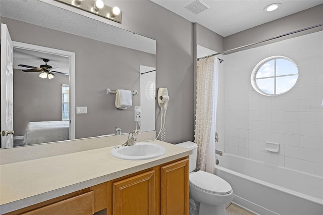 209 Rosso Dr, Davenport, FL 33837 - full bathroom featuring vanity, ensuite bathroom, toilet, shower / bath combination with curtain, and ceiling fan