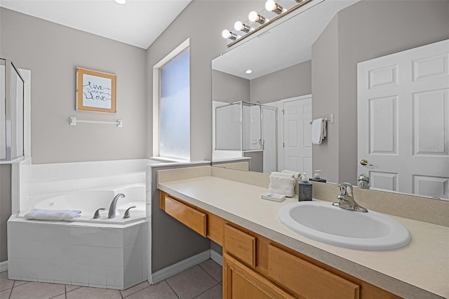 209 Rosso Dr, Davenport, FL 33837 - full bath featuring a garden tub, tile patterned floors, a shower stall, and vanity