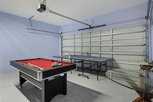 209 Rosso Dr, Davenport, FL 33837 - rec room featuring a garage, concrete block wall, and billiards