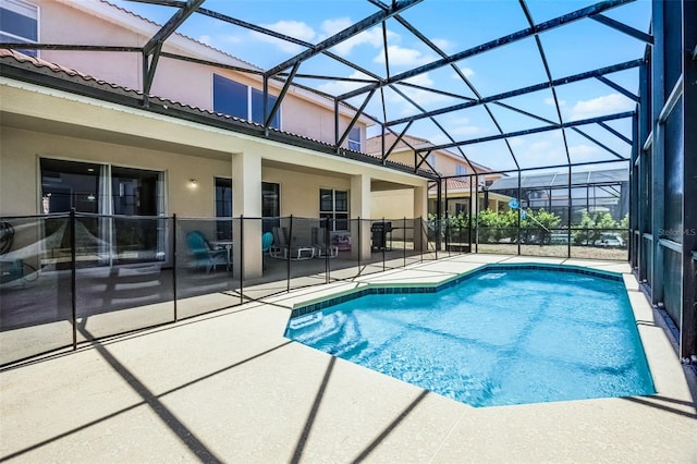 209 Rosso Dr, Davenport, FL 33837 - outdoor pool featuring a patio and glass enclosure