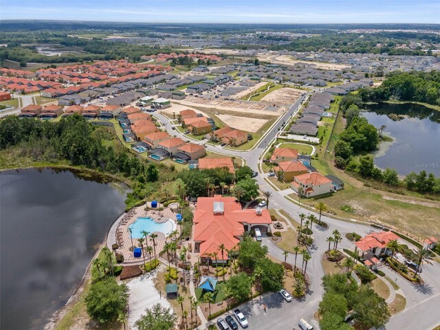 209 Rosso Dr, Davenport, FL 33837 - aerial view of property and surrounding area with a nearby body of water, a pool, and nearby suburban area