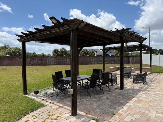 view of patio with a pergola, a fenced backyard, and outdoor dining space
