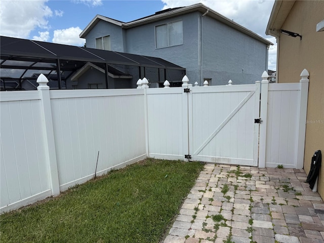 exterior space featuring fence and a gate