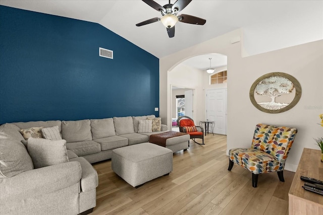 131 Highland Meadows Pl, Davenport, FL 33837 - living room featuring ceiling fan, light wood-style flooring, arched walkways, and high vaulted ceiling