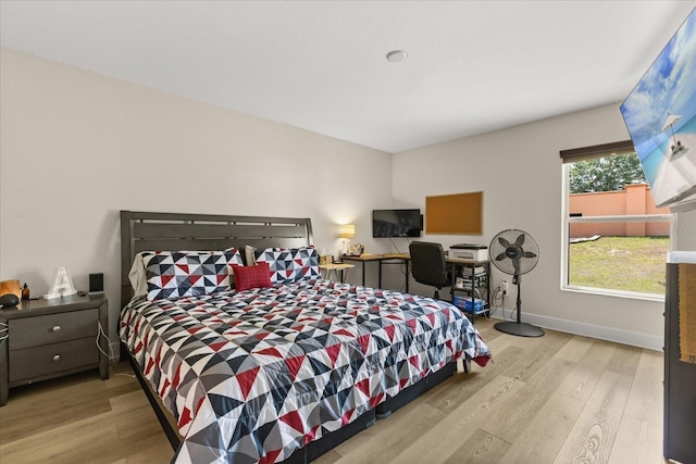 131 Highland Meadows Pl, Davenport, FL 33837 - bedroom featuring wood finished floors and baseboards