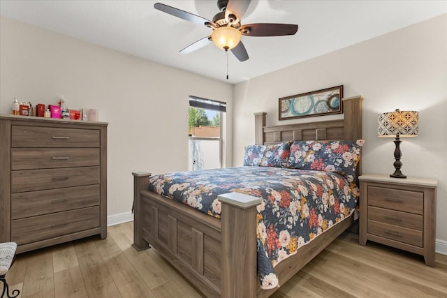 131 Highland Meadows Pl, Davenport, FL 33837 - bedroom featuring light wood finished floors, baseboards, and ceiling fan