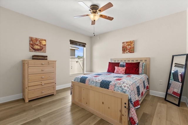131 Highland Meadows Pl, Davenport, FL 33837 - bedroom with light wood-type flooring, baseboards, and ceiling fan