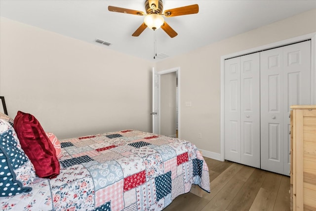 131 Highland Meadows Pl, Davenport, FL 33837 - bedroom featuring wood finished floors, a closet, ceiling fan, and baseboards