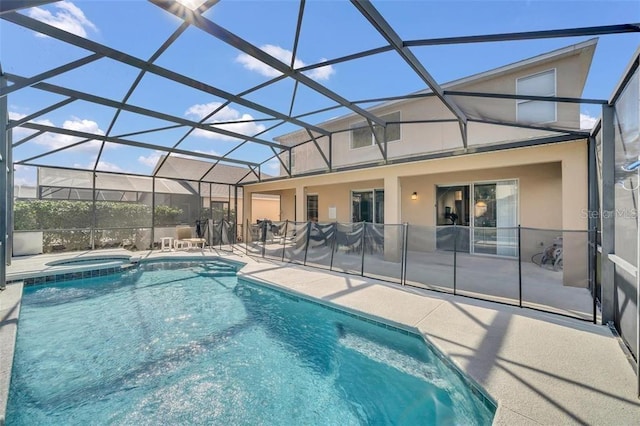 2632 Emerald Island Blvd, Kissimmee, FL 34747 - view of pool featuring a lanai, a patio, and a pool with connected hot tub