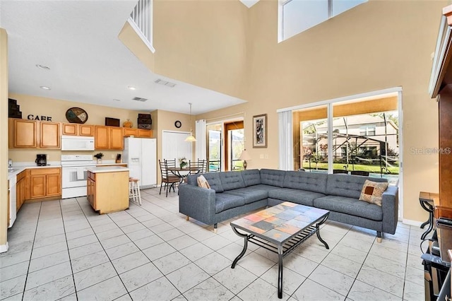 2632 Emerald Island Blvd, Kissimmee, FL 34747 - living room with a high ceiling and visible vents