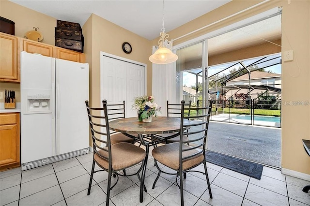 2632 Emerald Island Blvd, Kissimmee, FL 34747 - dining room featuring a sunroom and light tile patterned floors