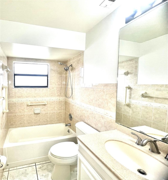 849 Long Bay Ct, Kissimmee, FL 34741 - full bath featuring tile walls, toilet, washtub / shower combination, vanity, and tile patterned flooring
