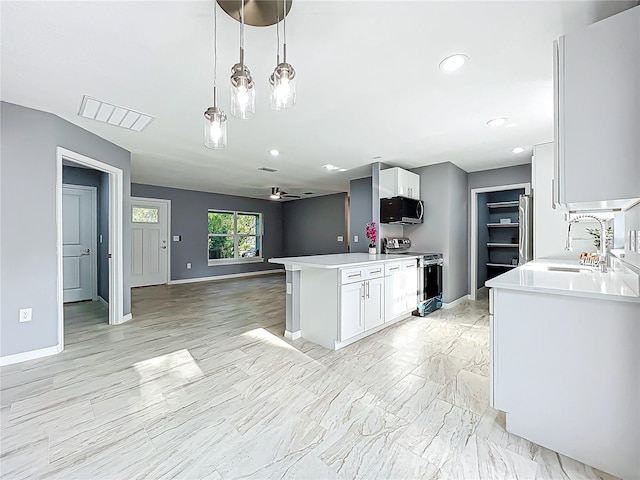 kitchen featuring white cabinets, appliances with stainless steel finishes, a sink, and visible vents