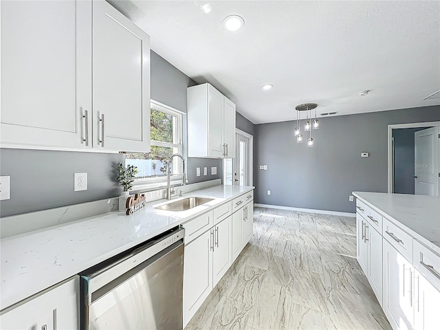 kitchen with pendant lighting, dishwasher, a sink, white cabinets, and recessed lighting