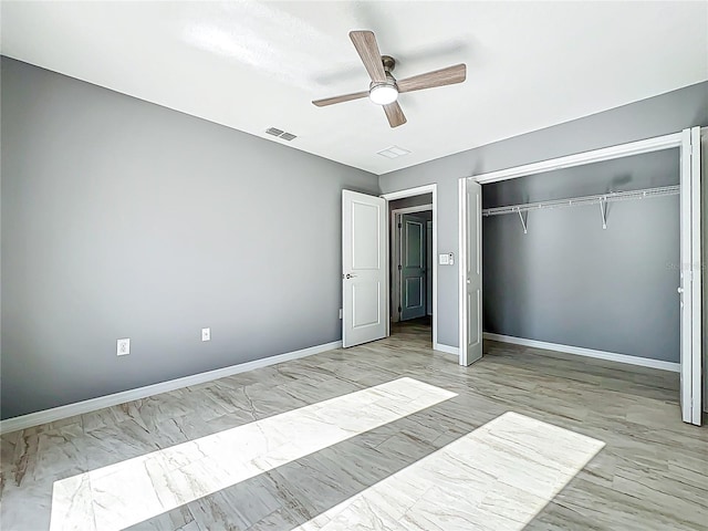 unfurnished bedroom featuring baseboards, a ceiling fan, a closet, and visible vents