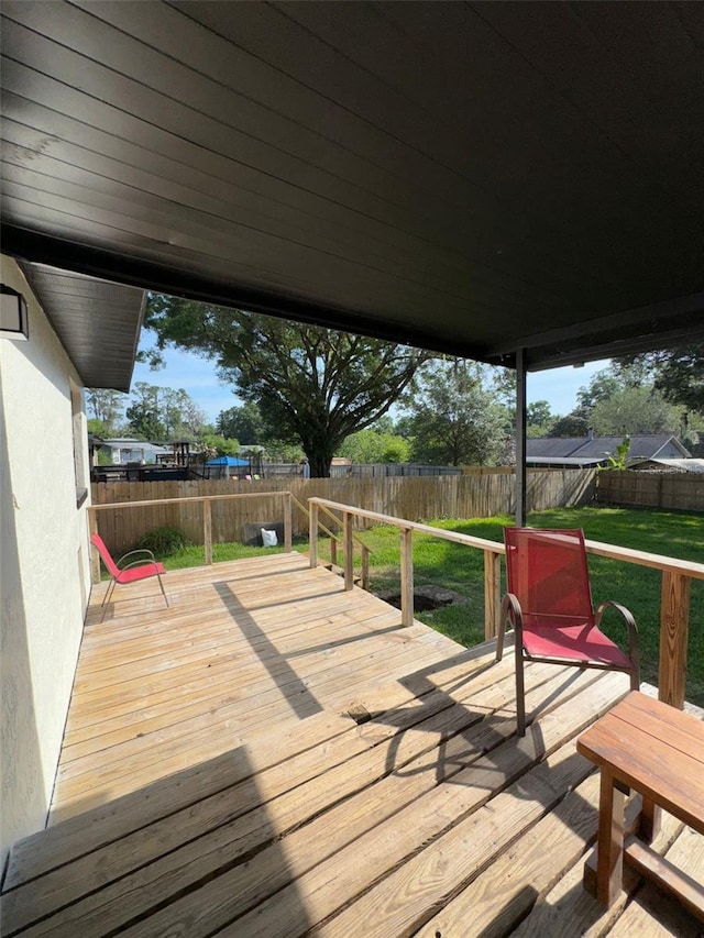 4385 NE 2nd Ct, Ocala, FL 34479 - wooden terrace featuring a yard and a fenced backyard
