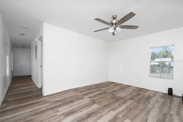 31 Cedar St, Haines City, FL 33844 - spare room with a ceiling fan and wood finished floors