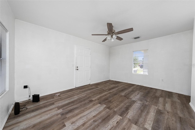 31 Cedar St, Haines City, FL 33844 - spare room featuring a ceiling fan, baseboards, visible vents, and wood finished floors