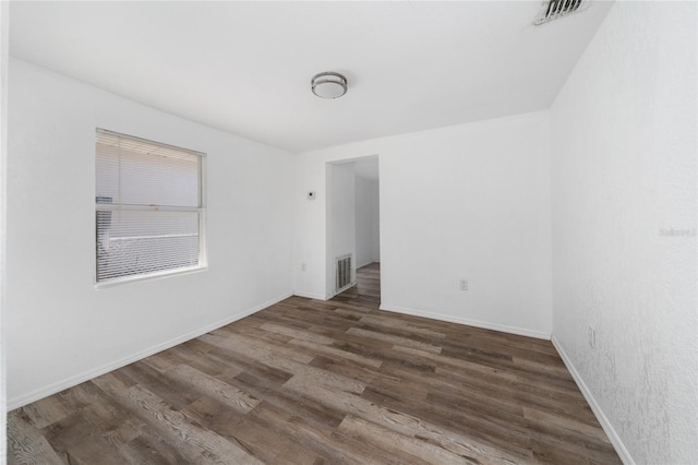31 Cedar St, Haines City, FL 33844 - unfurnished room with visible vents, baseboards, and wood finished floors