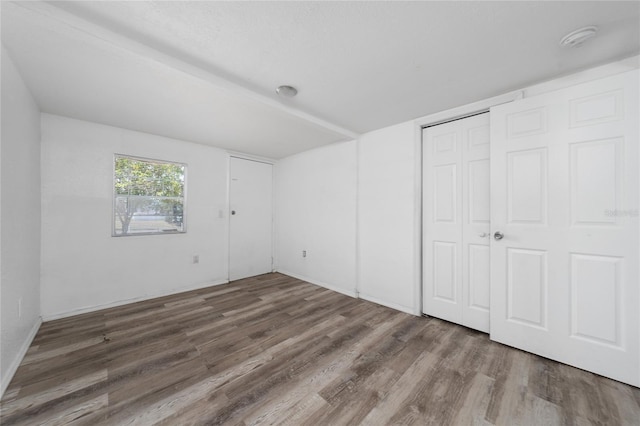 31 Cedar St, Haines City, FL 33844 - unfurnished bedroom featuring wood finished floors and a closet