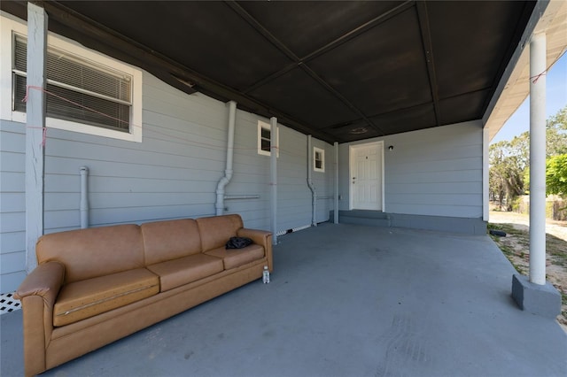 31 Cedar St, Haines City, FL 33844 - view of patio featuring outdoor lounge area and an attached carport