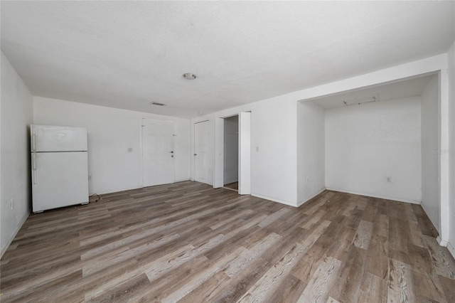 31 Cedar St, Haines City, FL 33844 - empty room featuring wood finished floors